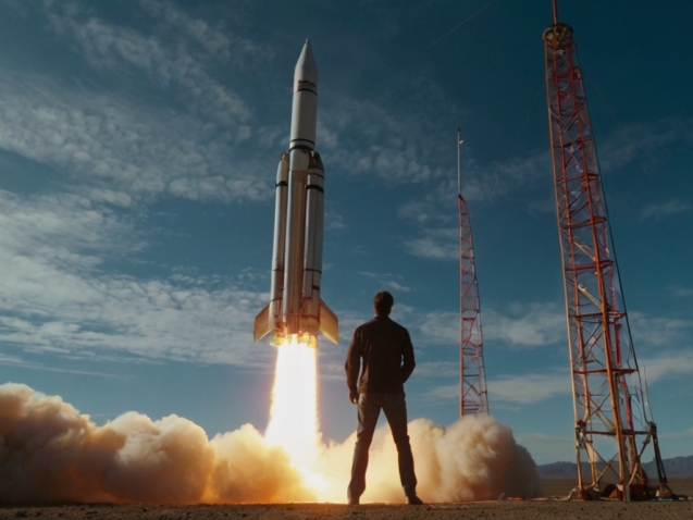 A man watching a rocket launch