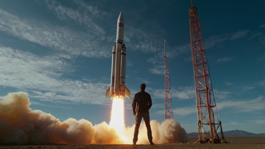 A man watching a rocket launch